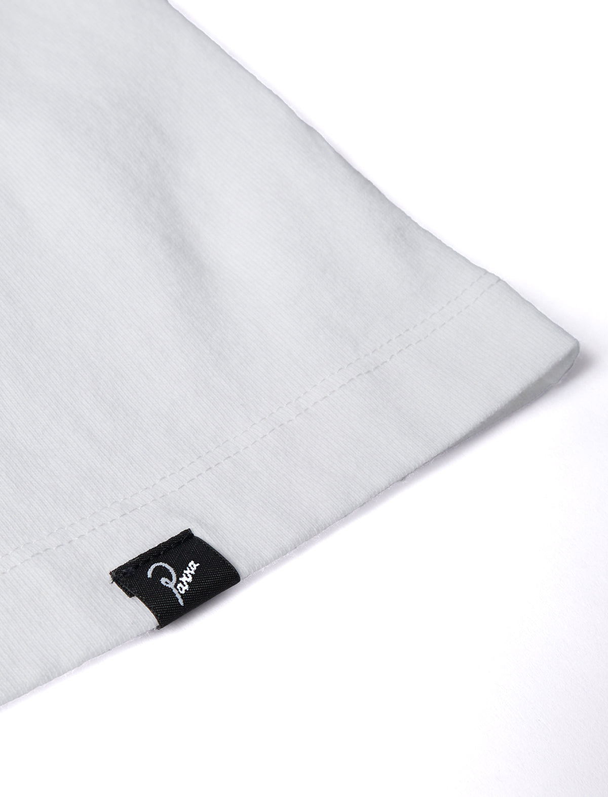 White By Parra T-Shirt with a brand label on a white background