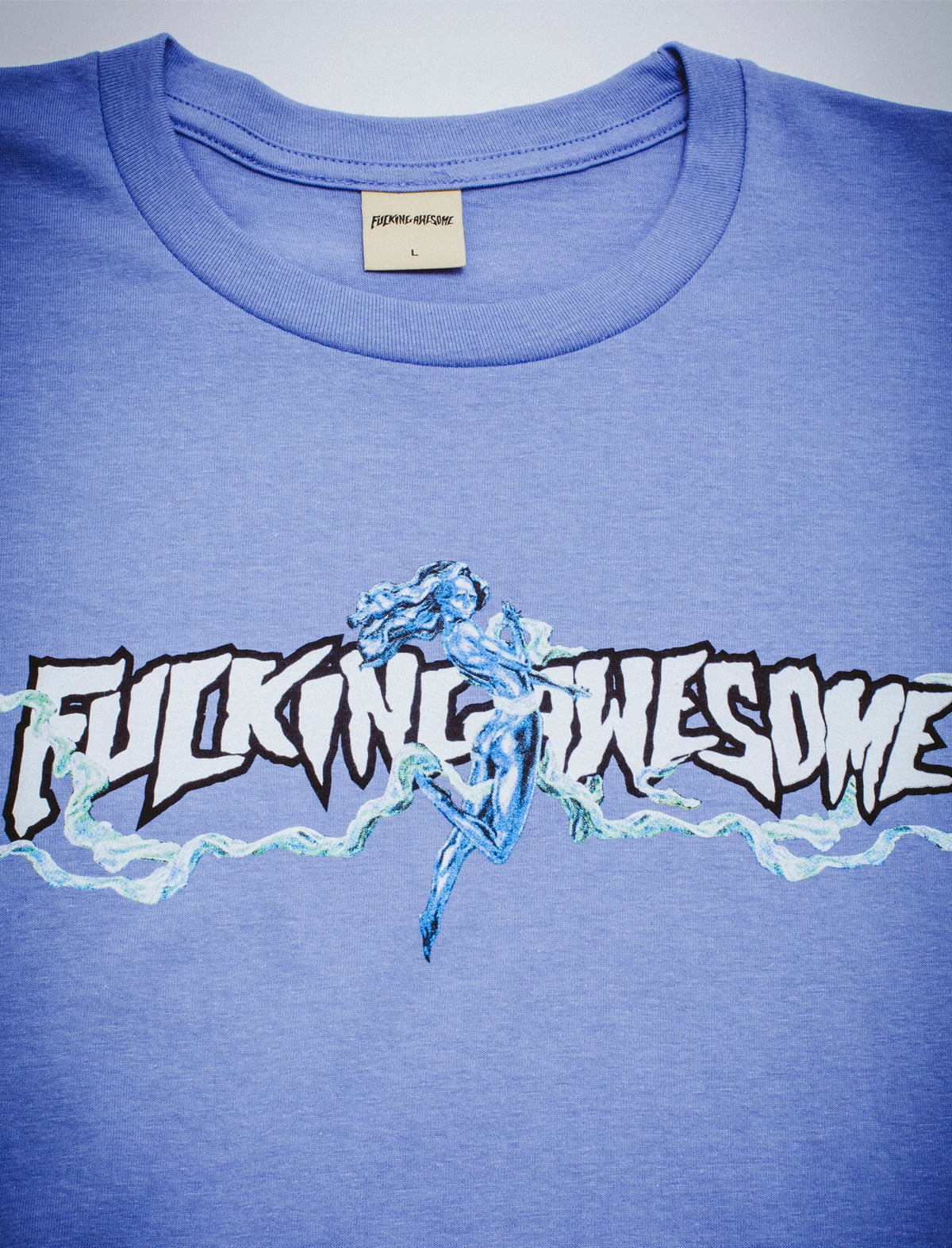Blue t-shirt with 'Fucking Awesome' graphic design on a plain background