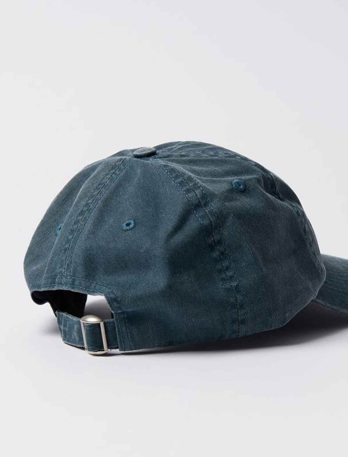 By Parra Blue denim cap on a white background