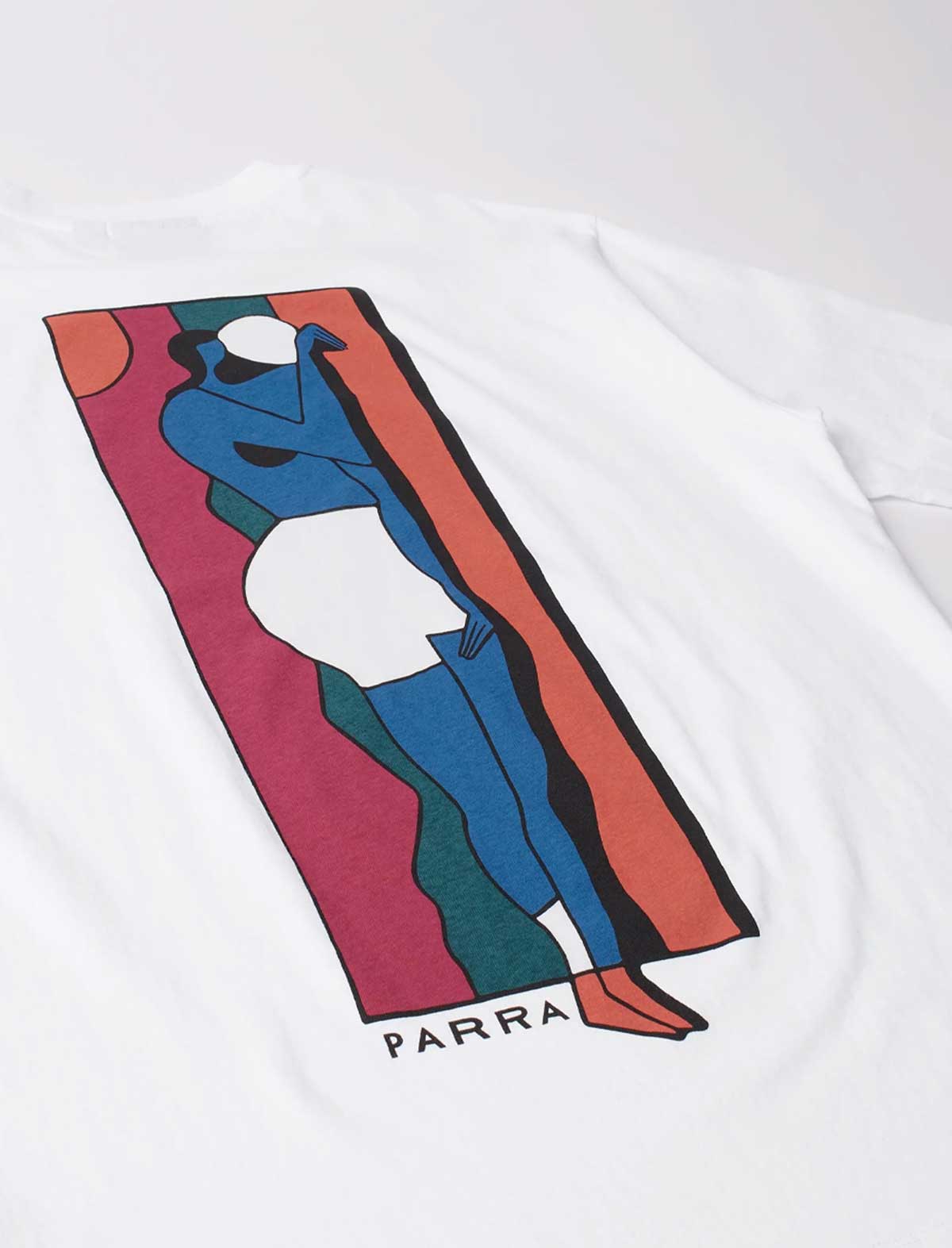A white short-sleeve T-shirt laid flat, featuring a large colorful graphic print of a stylized figure in blue, white, black, coral, and magenta, with the word 'PARRA' printed below the graphic.