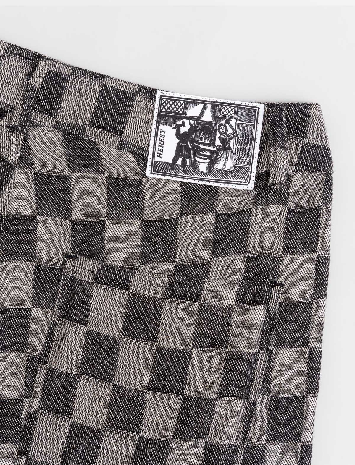 Checkered pants with a brand label on a white background