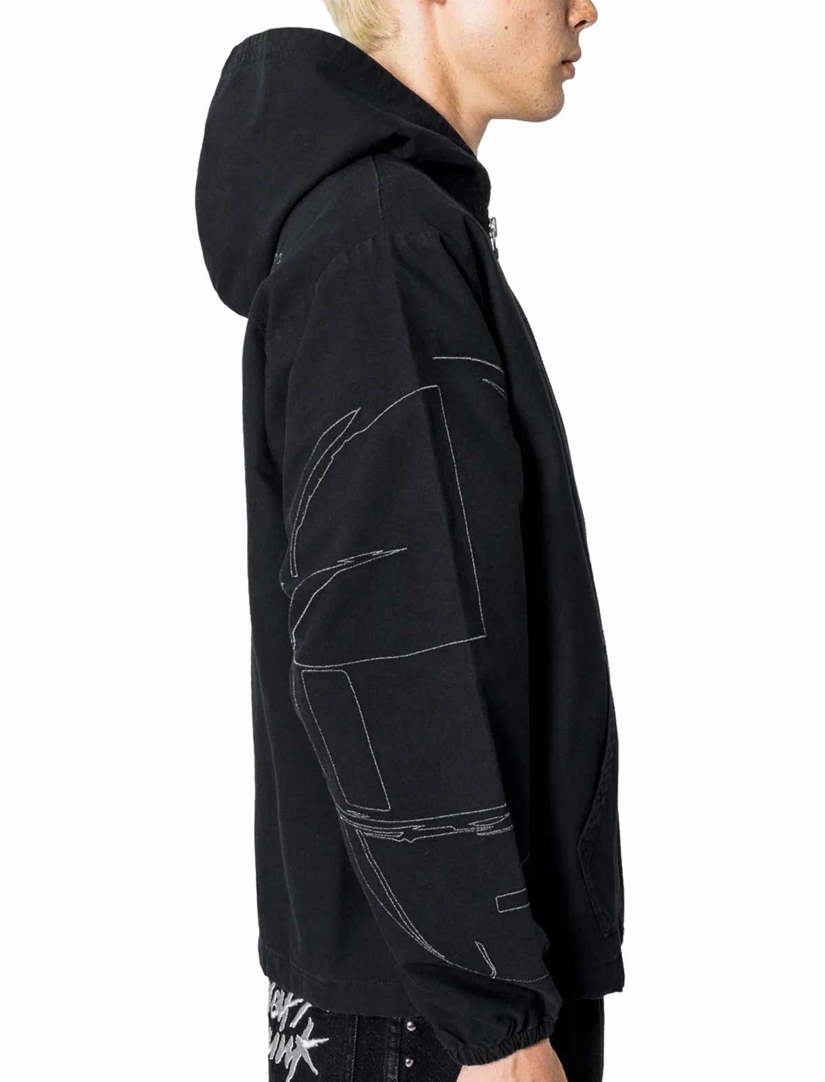 Black hoodie with white designs worn by a person on a white background