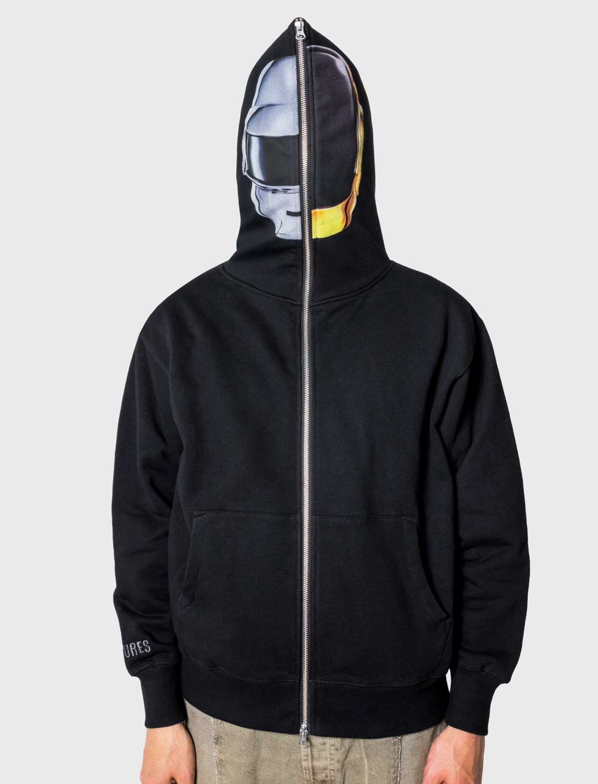 Black hoodie with a unique design on the back, featuring a faceless figure with a yellow hat.
