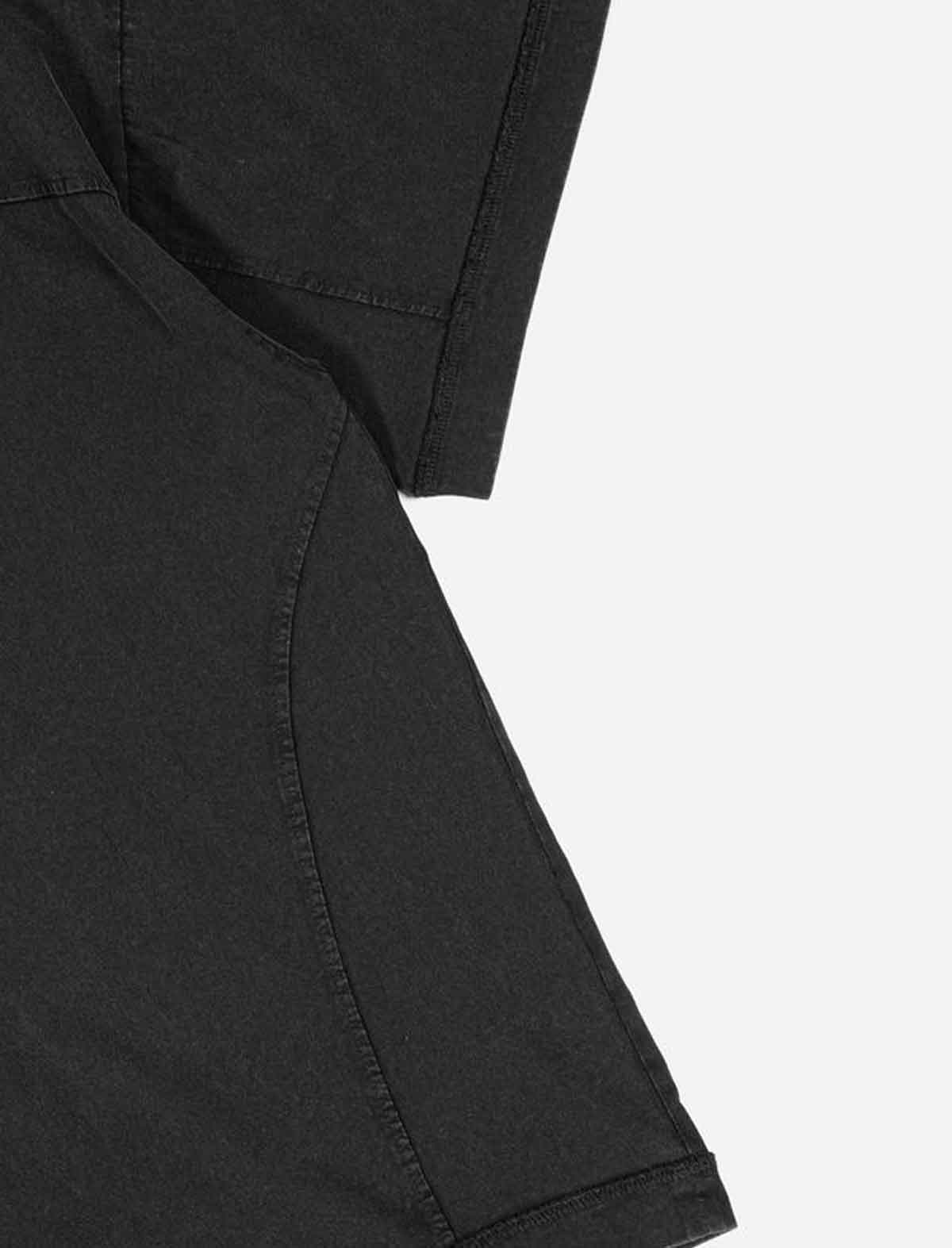 Close-up of a Wasted Paris x Umbro Boxy black shirt sleeve on a white background