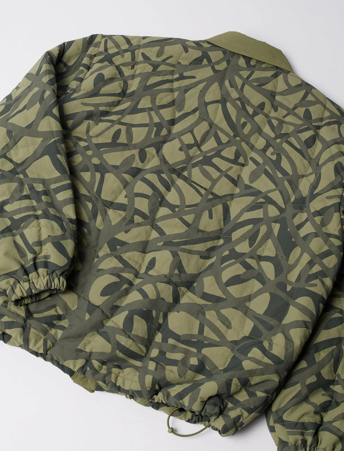 Green camouflage-patterned jacket on a white background