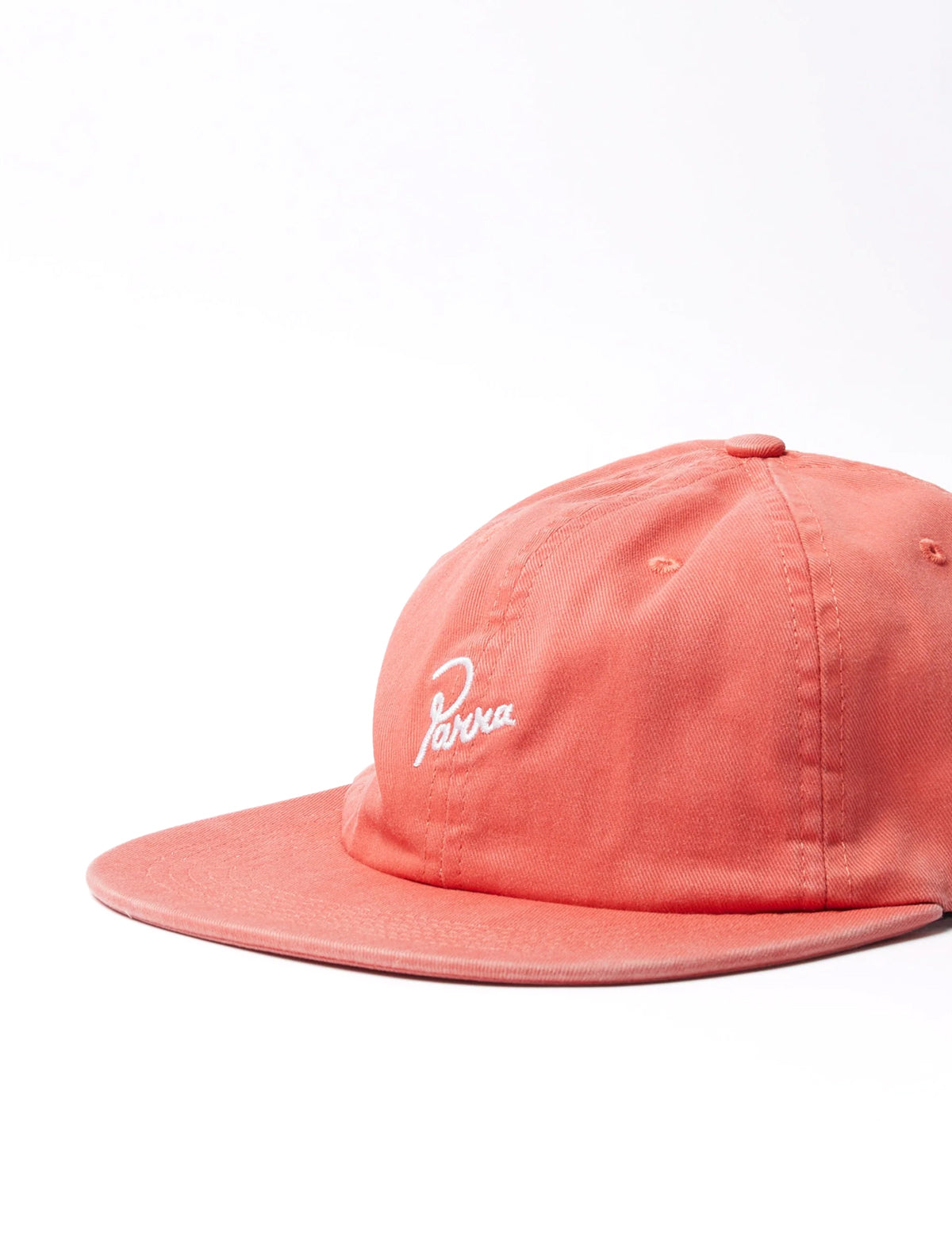 by parra red cap with a brand logo on a white background