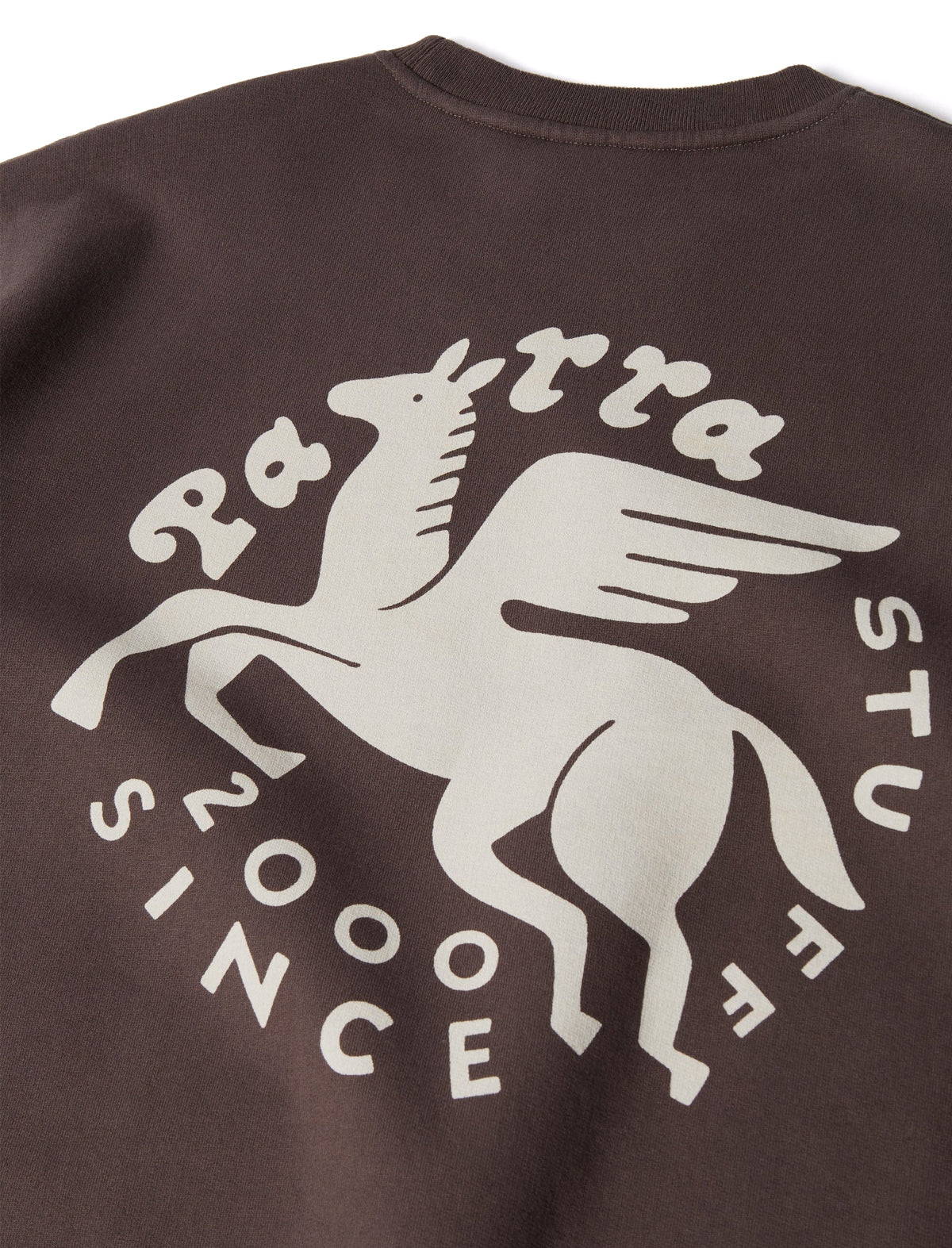 By Parra graphic on a brown sweater on a white background