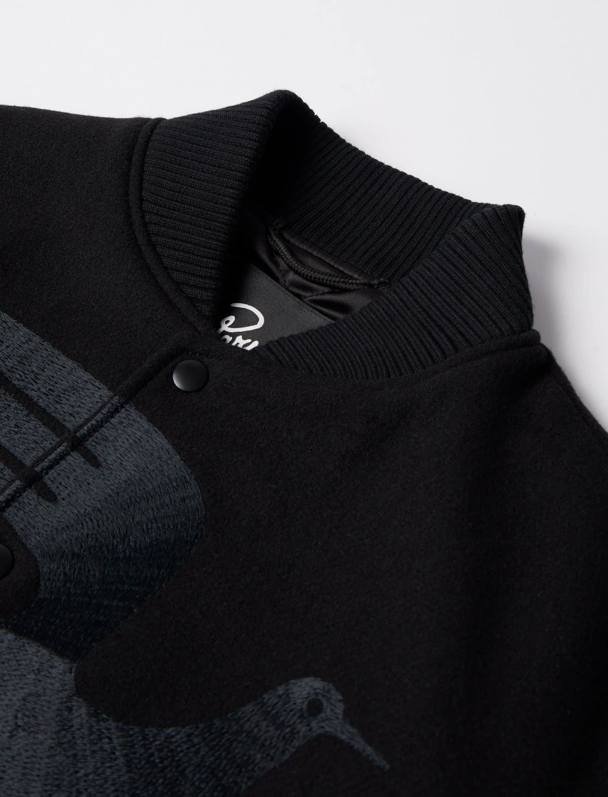 Black sweater with a brand logo on a white background