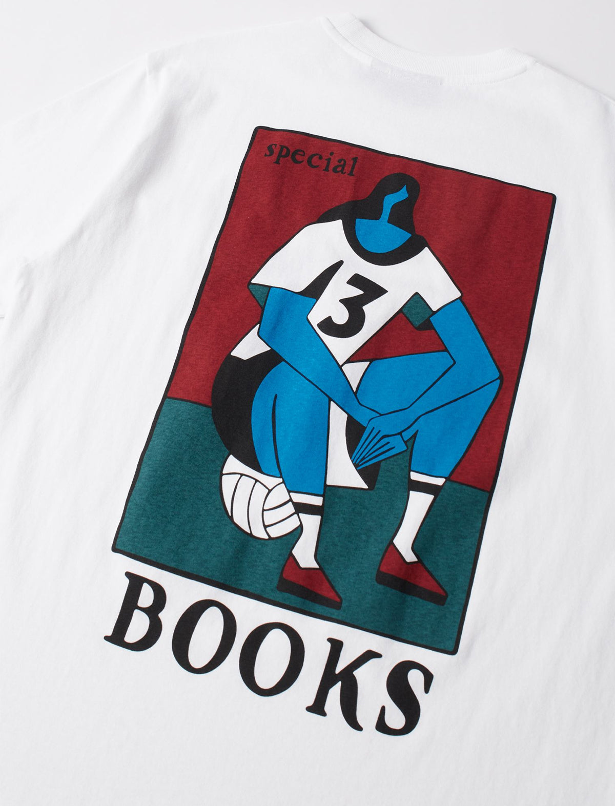 White t-shirt with a graphic design of a blue figure, number 13, and 'special books' text on a red and green background.
