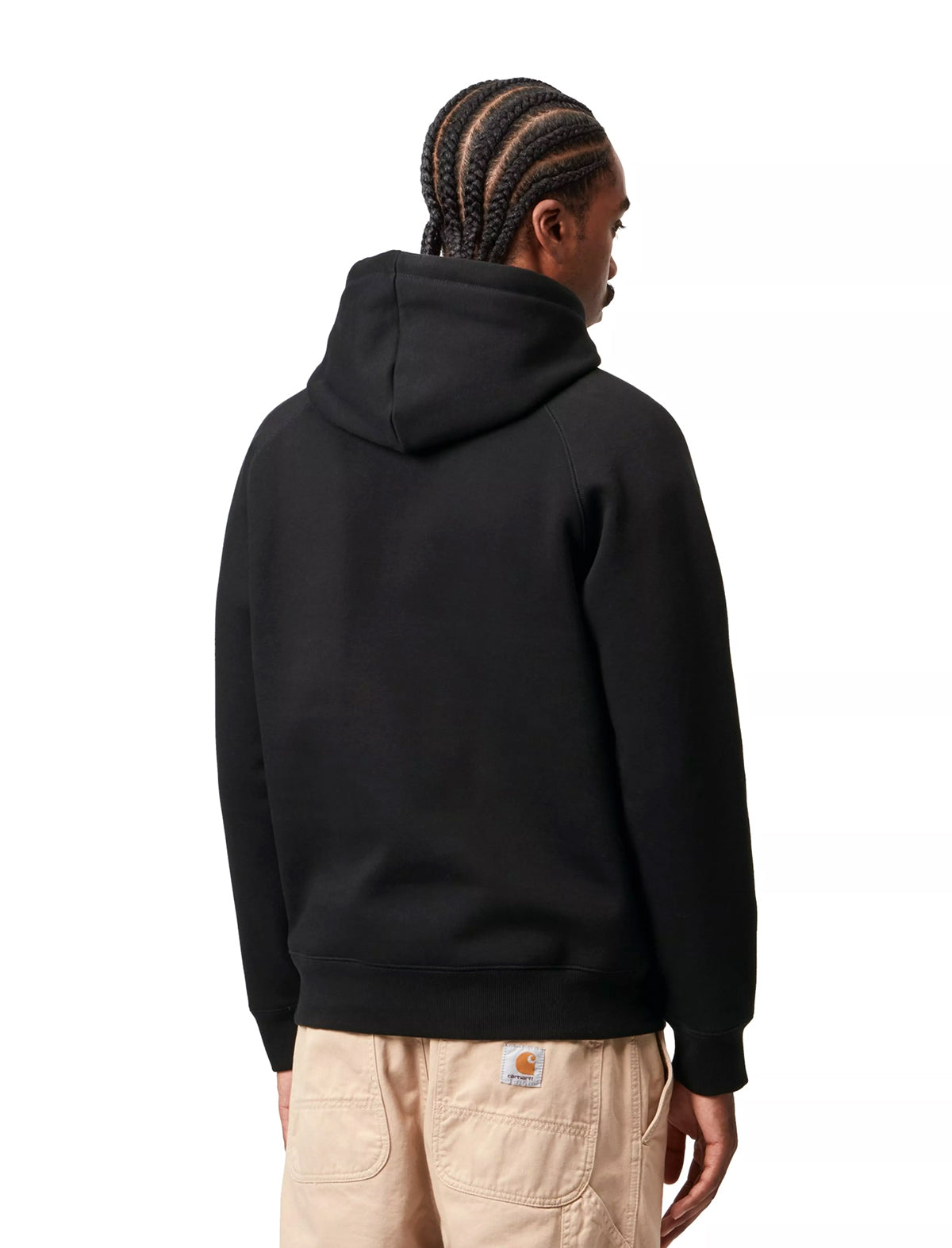 Person wearing a black hoodie on a white background