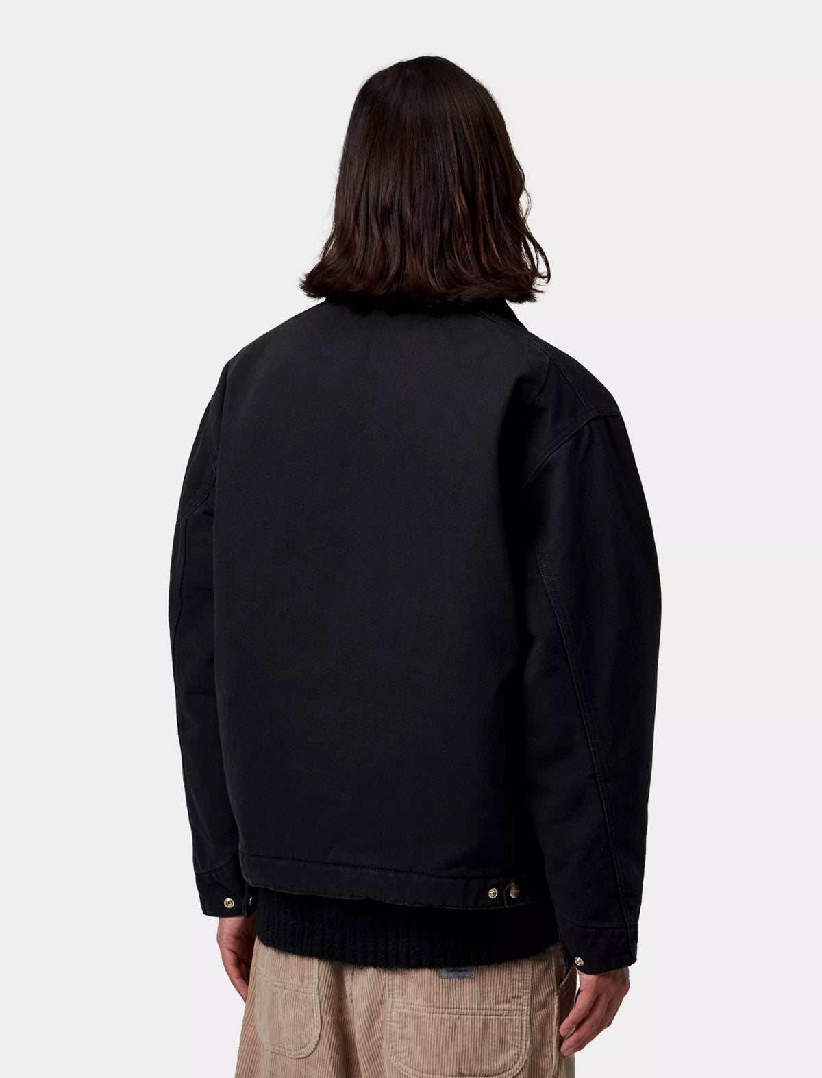 Carhartt WIP OG Detroit Jacket in Black Stone Washed, worn on model, back
