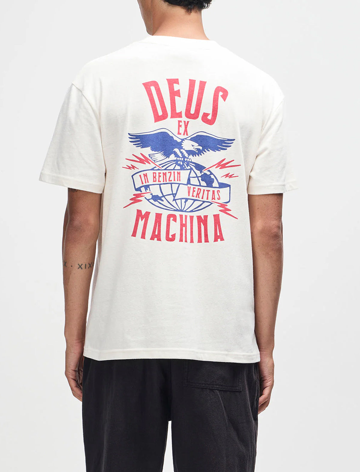 Person wearing a white t-shirt with 'Deus Ex Machina' logo on the back