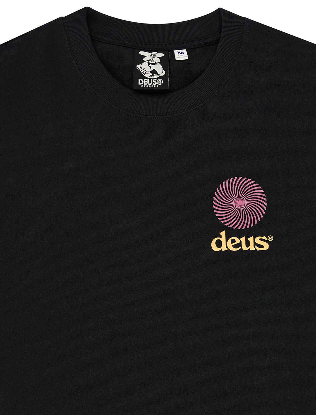 Black crewneck t-shirt featuring a pink spiral graphic and the word 'deus' in gold on the left chest, with a branded neck label.