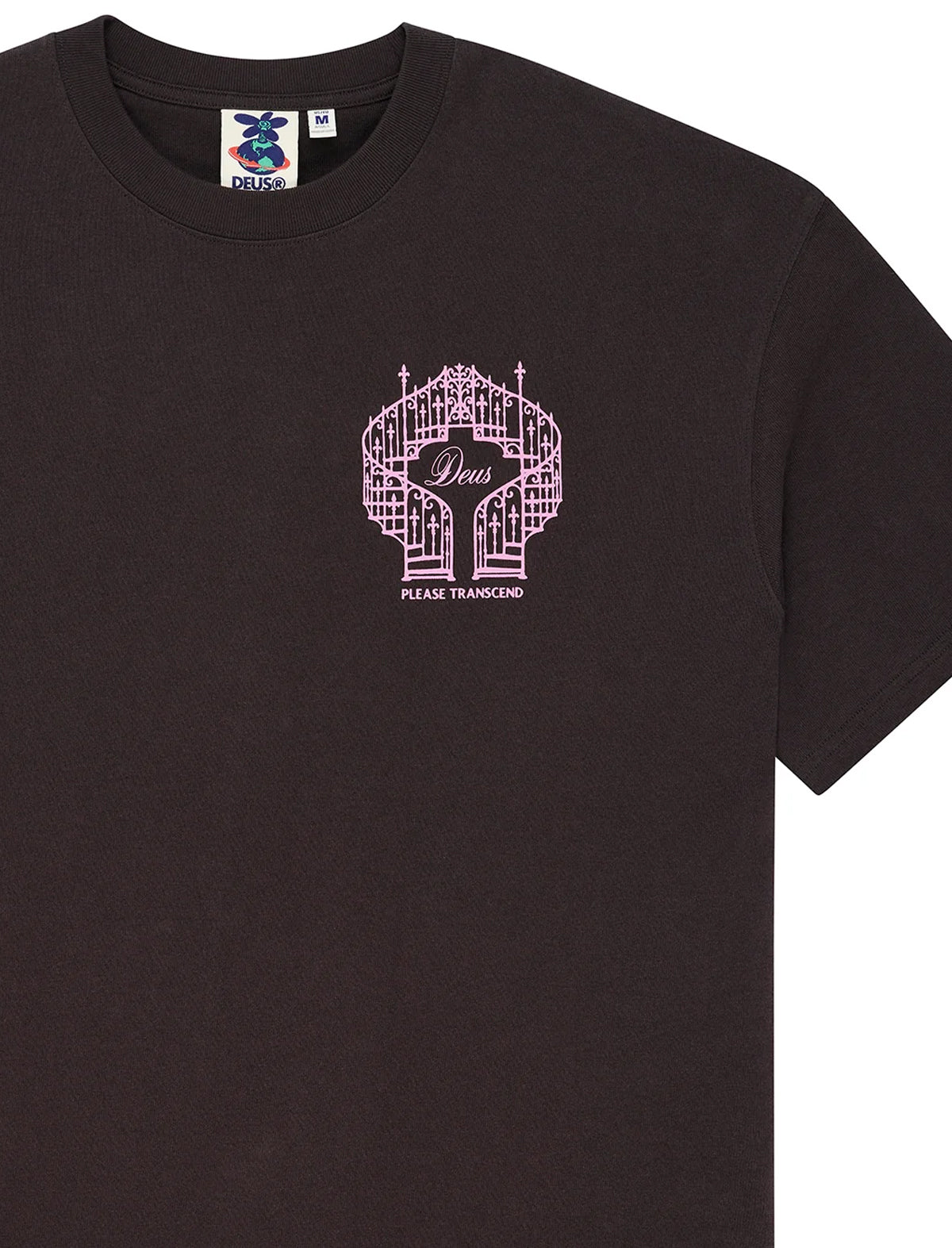 A black short-sleeve crewneck t-shirt featuring a pink graphic of a bridge with the word 'Deus' and the text 'PLEASE TRANSCEND' printed on the chest.