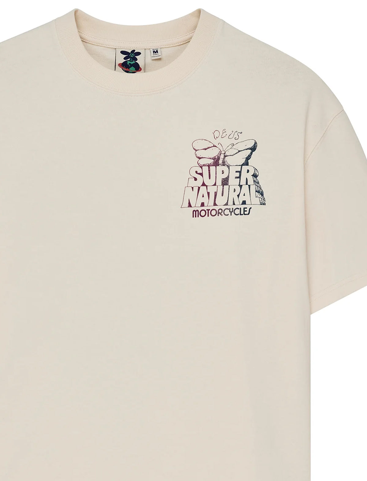 A cream-colored short-sleeve t-shirt featuring a graphic print on the left chest with a butterfly and the text 'SUPER NATURAL MOTORCYCLE' and 'Odds & Ends'.