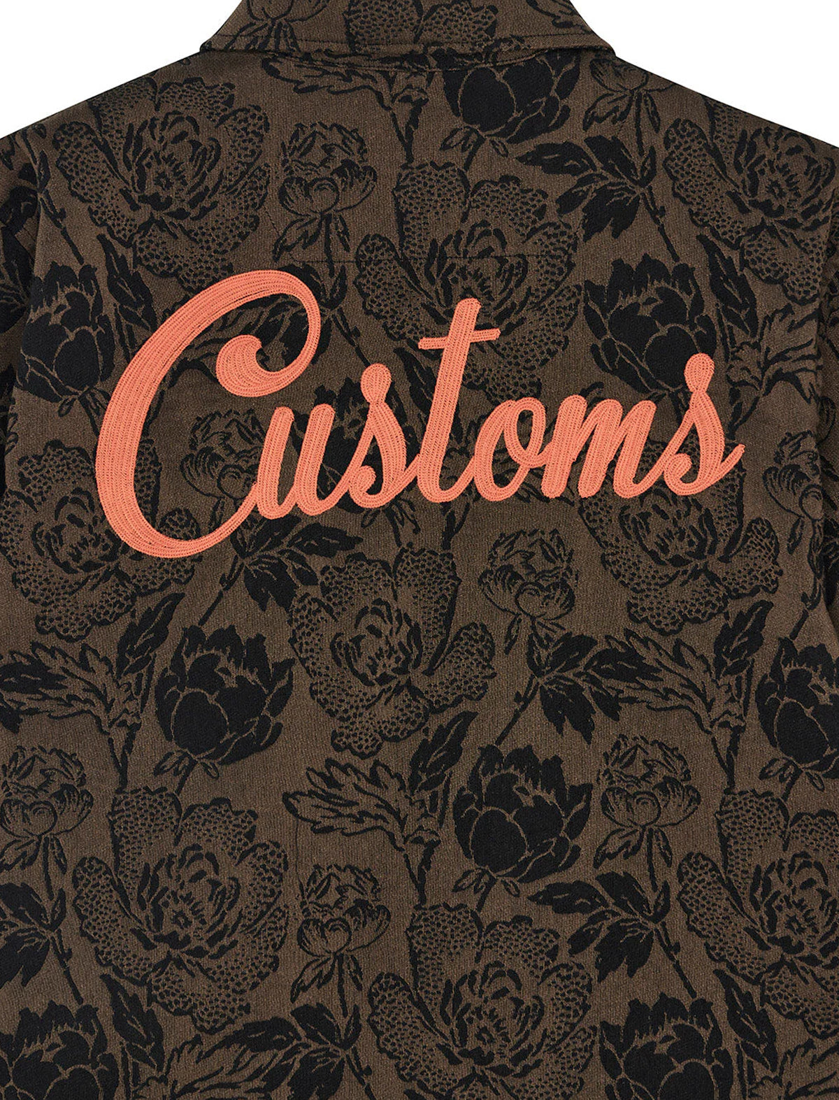 Floral patterned jacket with 'Customs' text on a dark background