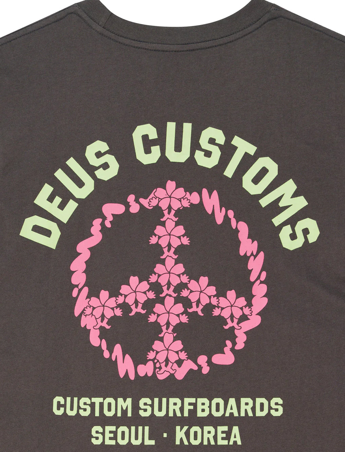 Black t-shirt with 'Deus Customs' and peace symbol design on the back