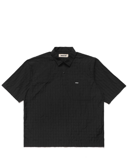 Black polo shirt on a light gray background