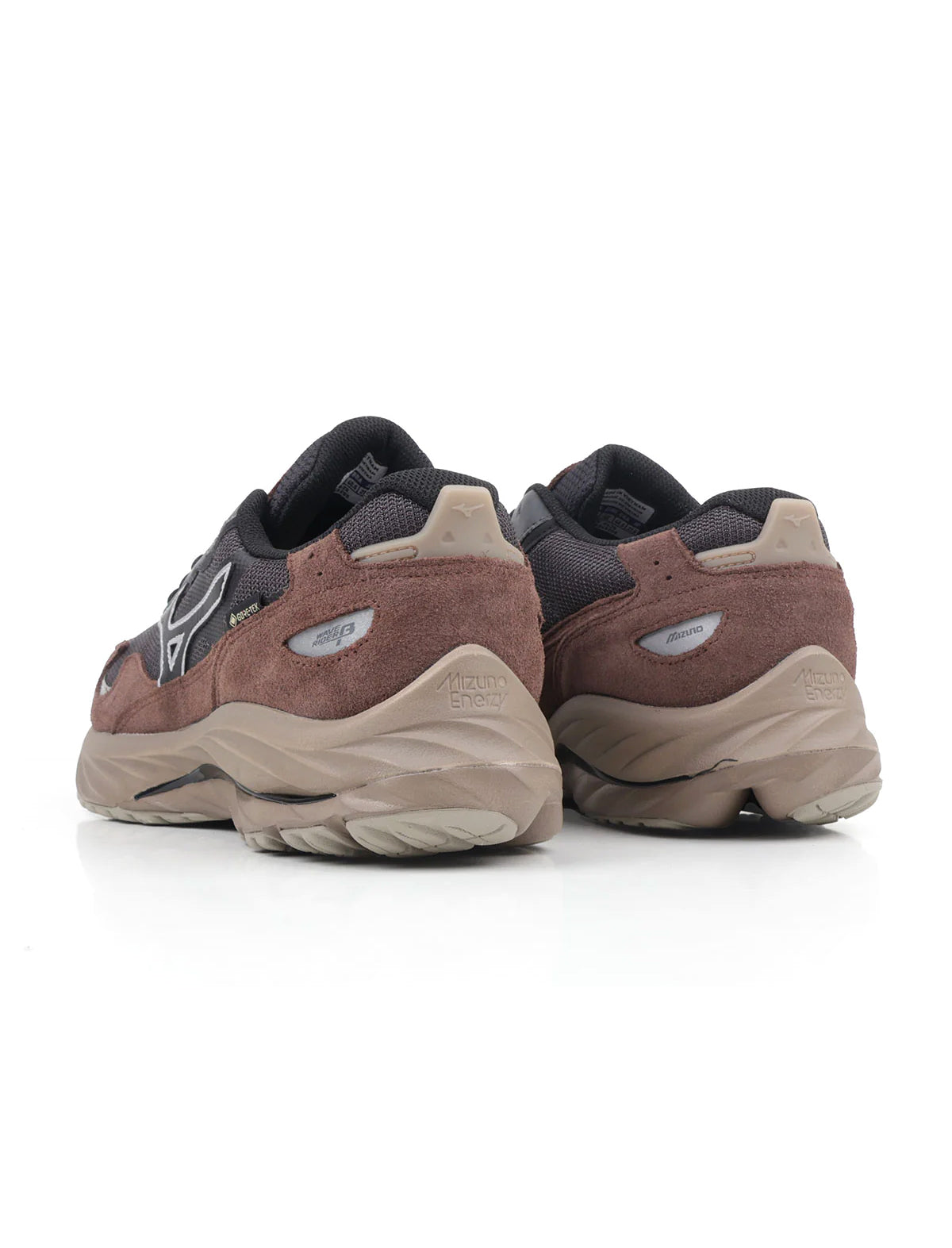 Pair of brown and black sneakers on a white background