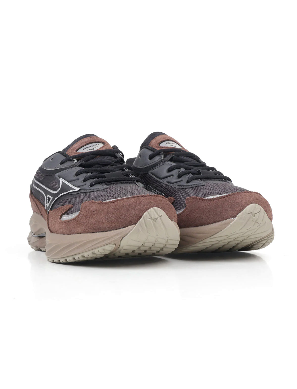 Pair of brown and black running shoes on a white background