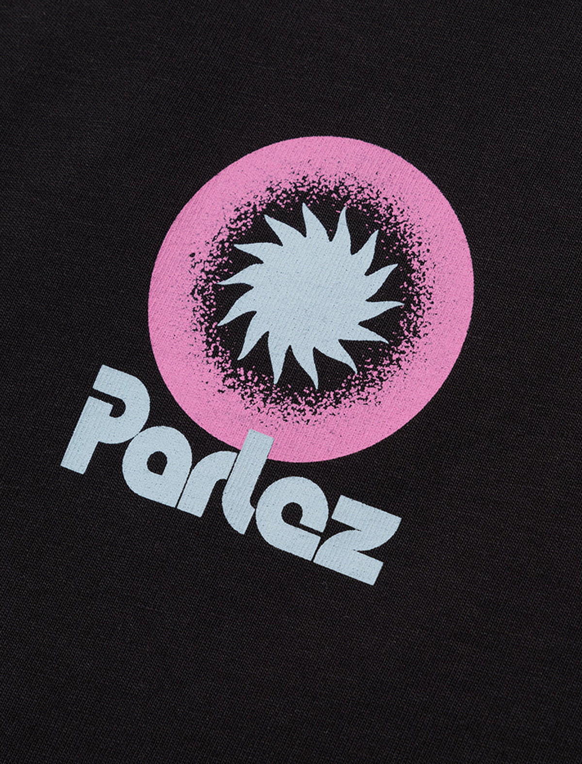 Black t-shirt with a pink circle and star design and 'Parlez' branding.