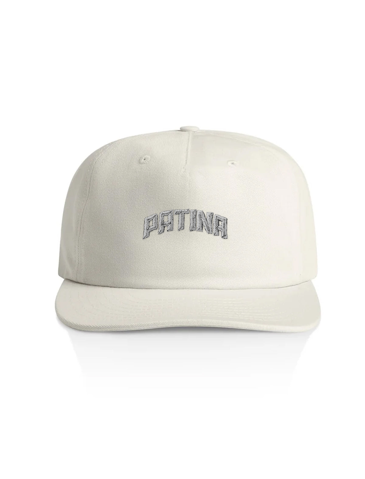 An off-white structured baseball cap with 'PATINA' embroidered in gray arched lettering on the front, shown against a plain white background.
