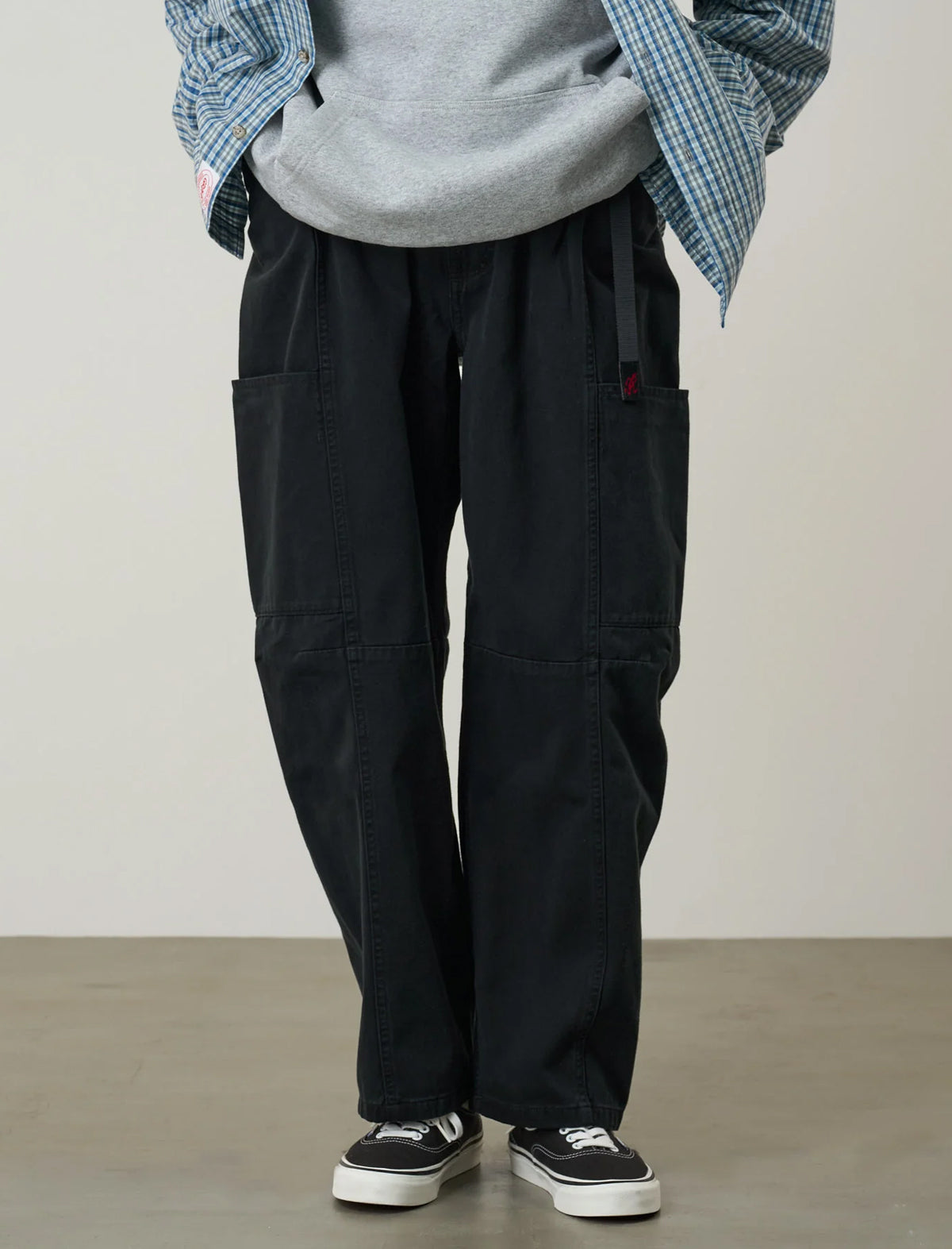 Model wearing the Gramicci Women's Voyager Pants in Black, close-up detail