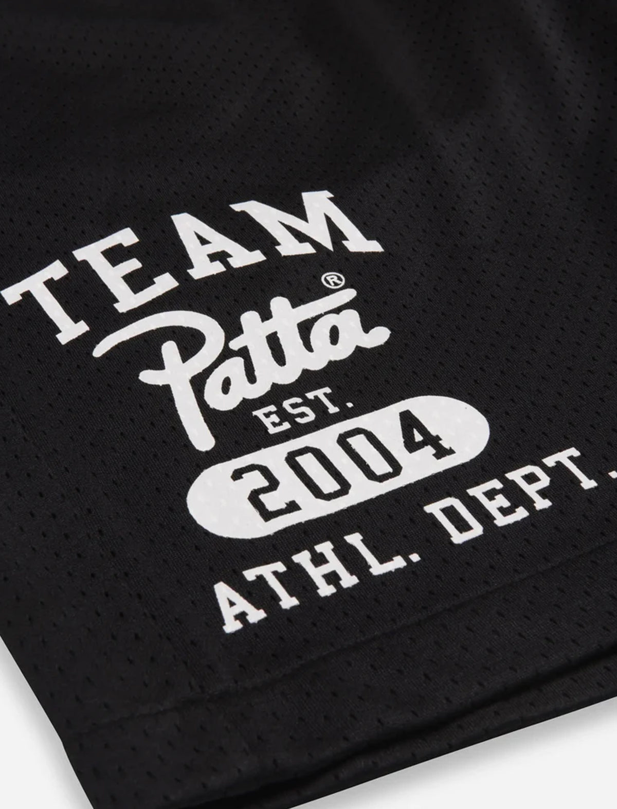 Black athletic shirt with white text 'Team Patta Est. 2004 Athl. Dept.' on a white background