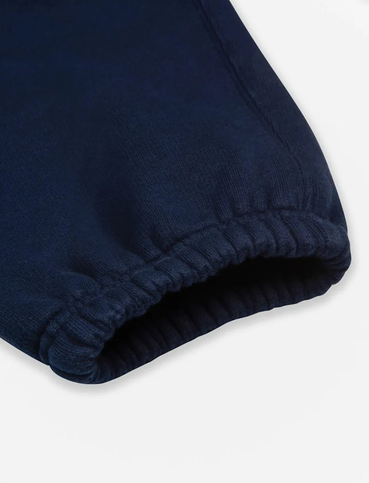 Close-up of navy blue fabric on a white background