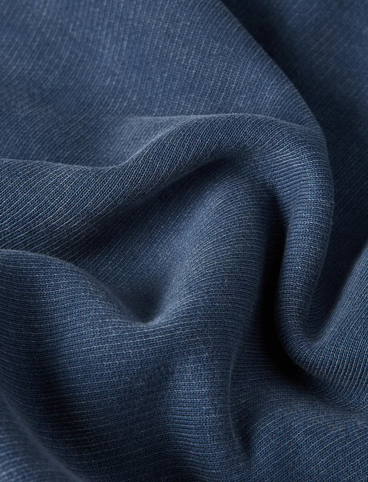 Close-up of blue fabric with a textured pattern