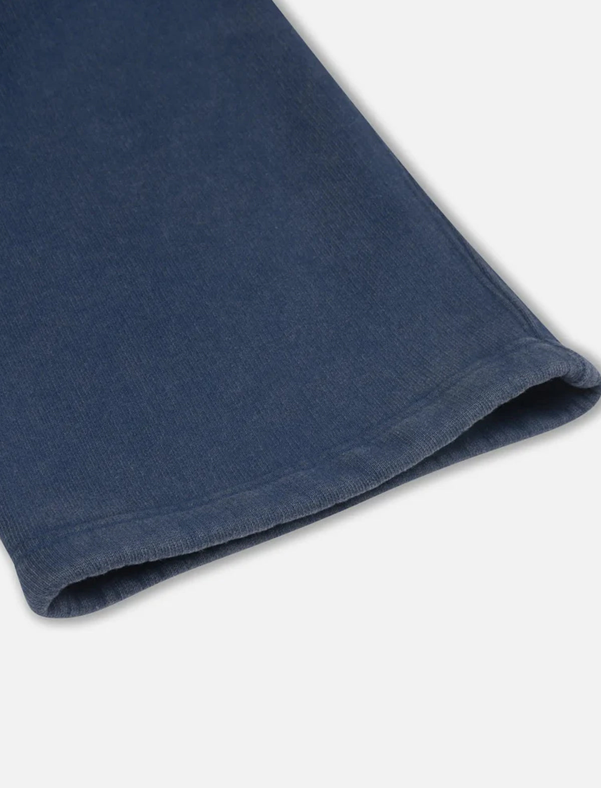 Close-up of a folded blue fabric on a white background
