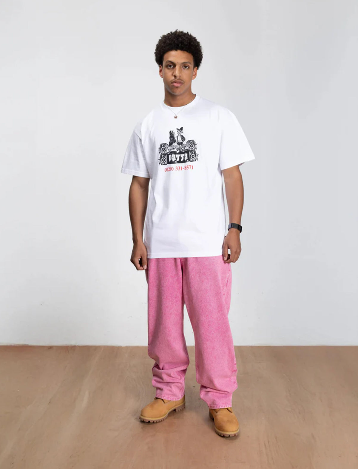 patta dj skully t-shirt in white on a man wearing pink trousers