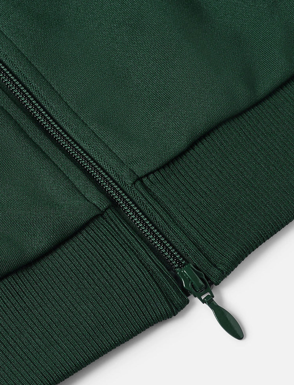 Close-up of a green jacket with a zipper on a white background