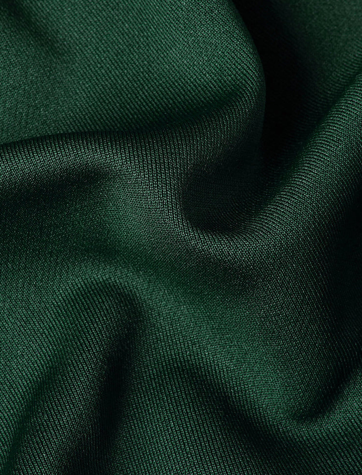 Close-up of dark green fabric with visible texture