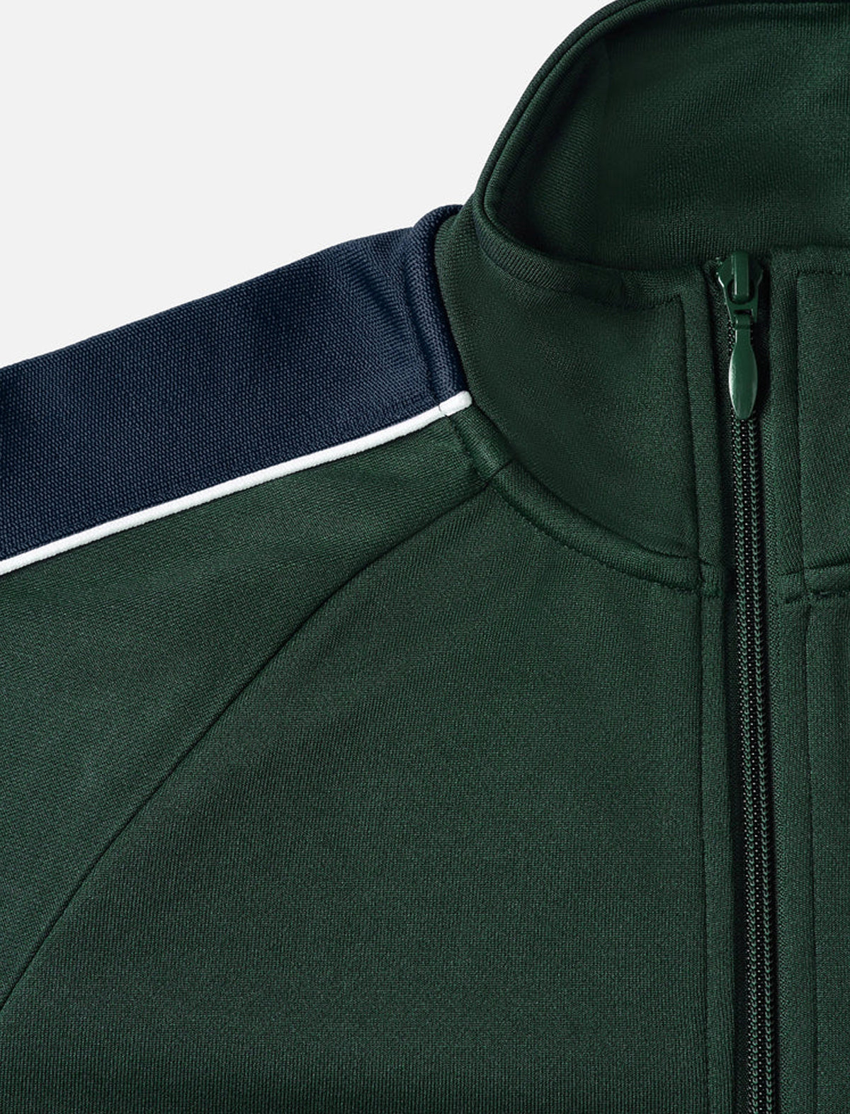 Close-up of a green jacket with a zipper and navy stripe on a white background