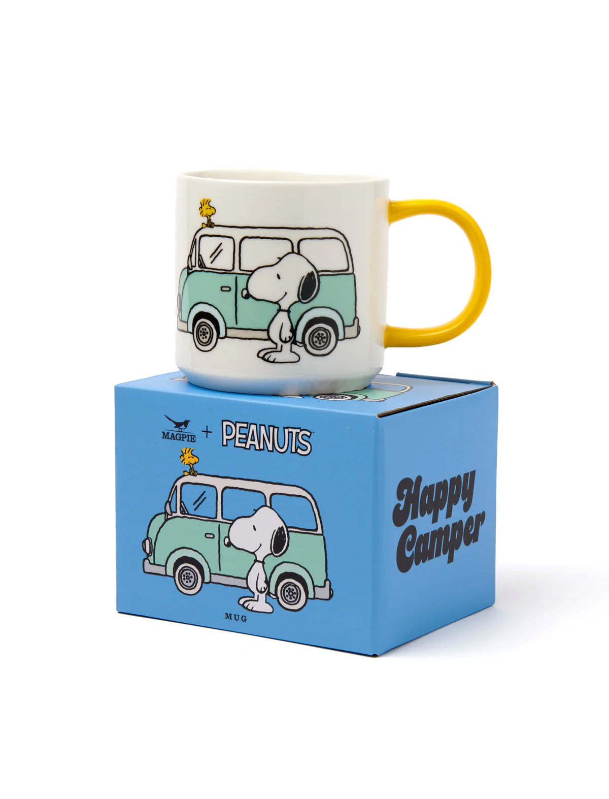 Snoopy mug with yellow handle on a blue box featuring Peanuts branding