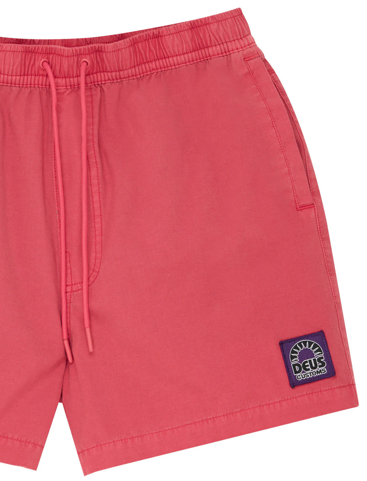 Red shorts with a brand logo on a white background