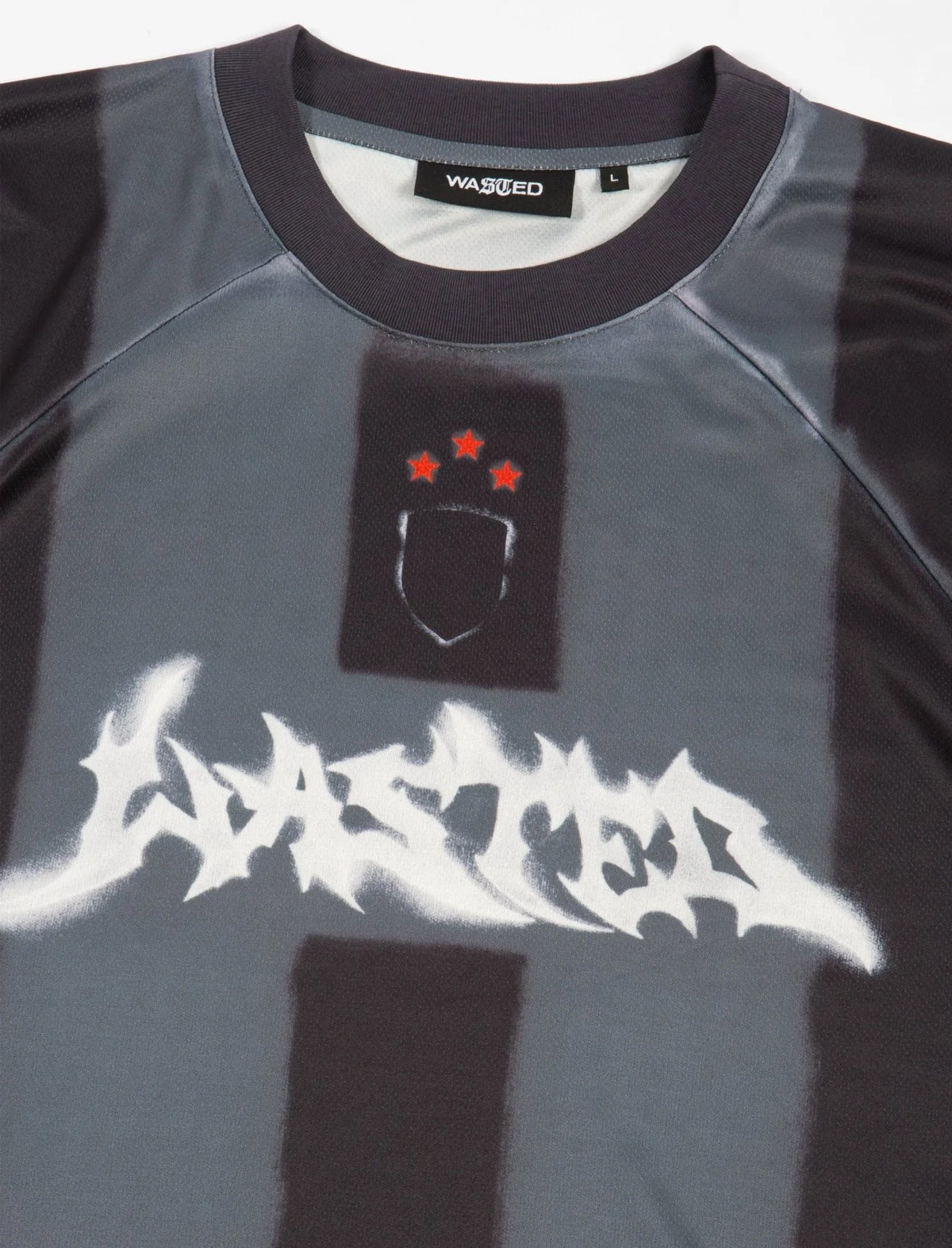 Gray and black shirt with white text and red accents on a plain background