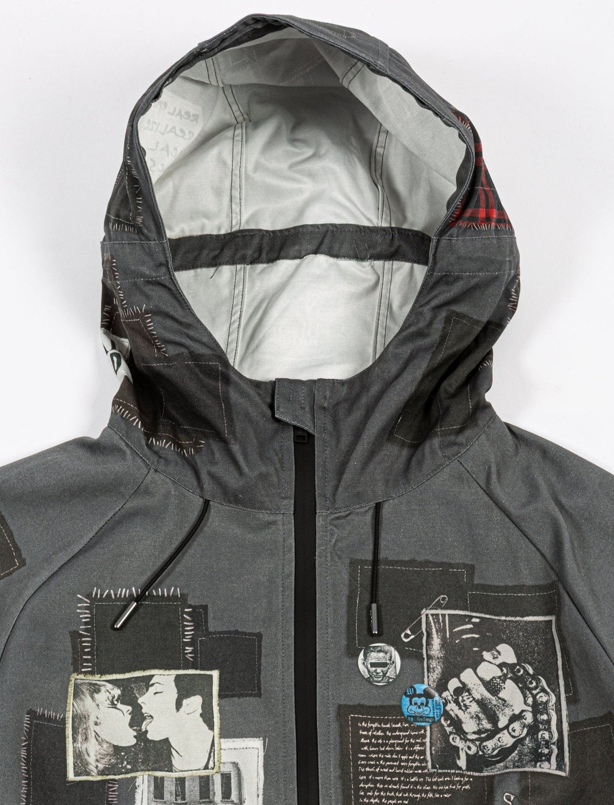 Gray jacket with hood and graphic designs on a white background