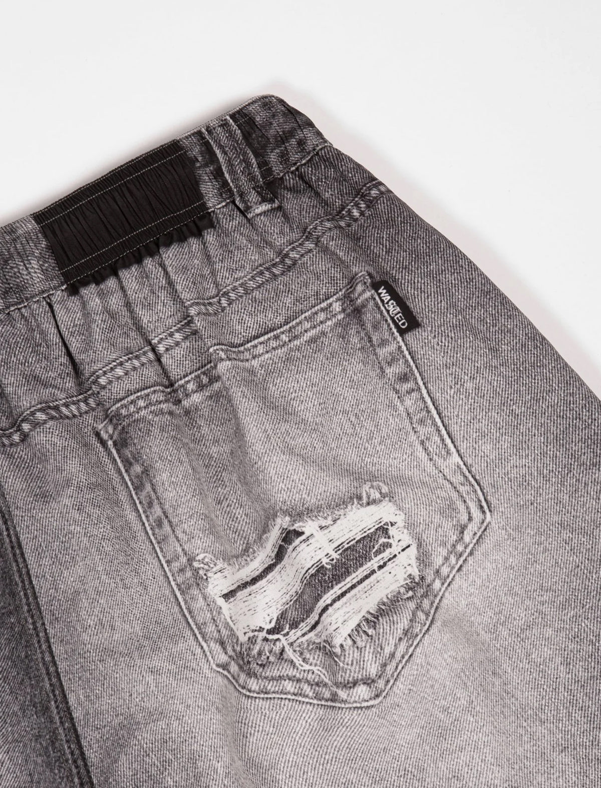 Gray denim shorts with a visible brand label on a white background