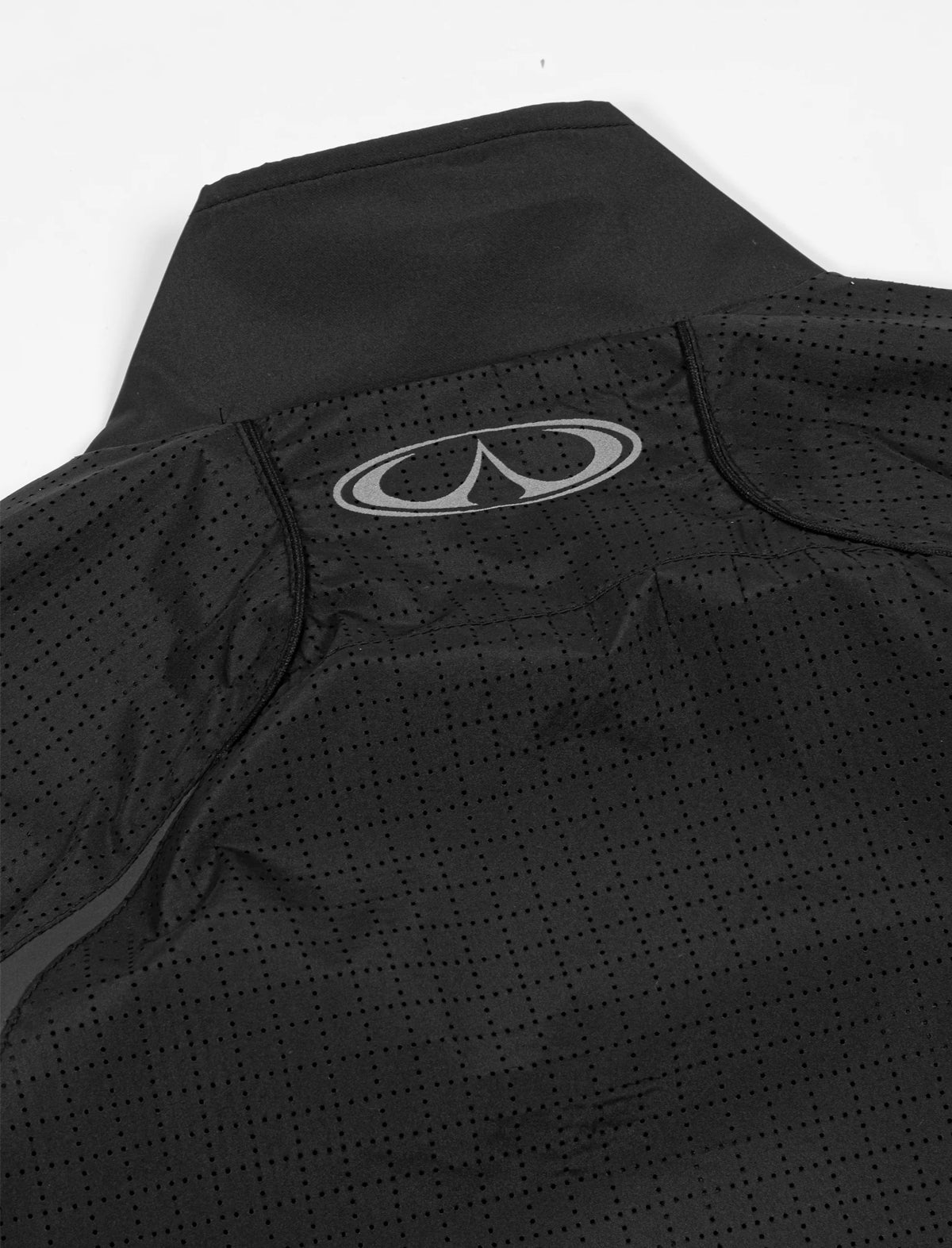Close-up of a navy blue knit sweater with a button and Zanone label on a light gray background