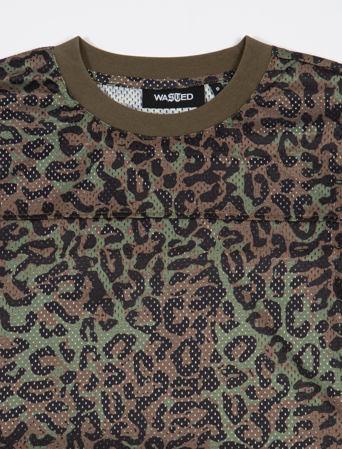 Close-up of a shirt with a leopard print pattern and 'Wasted' brand label.