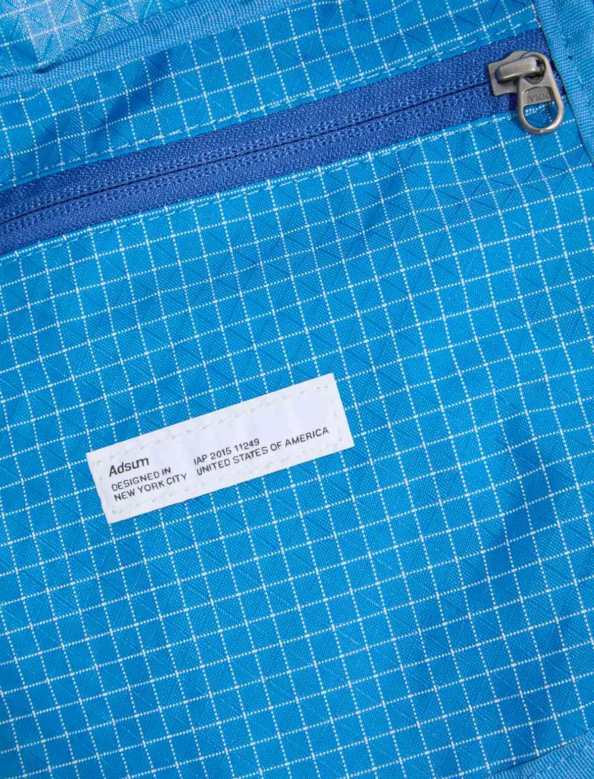 Adsum Zip Tote Bag Blue zip detail and label