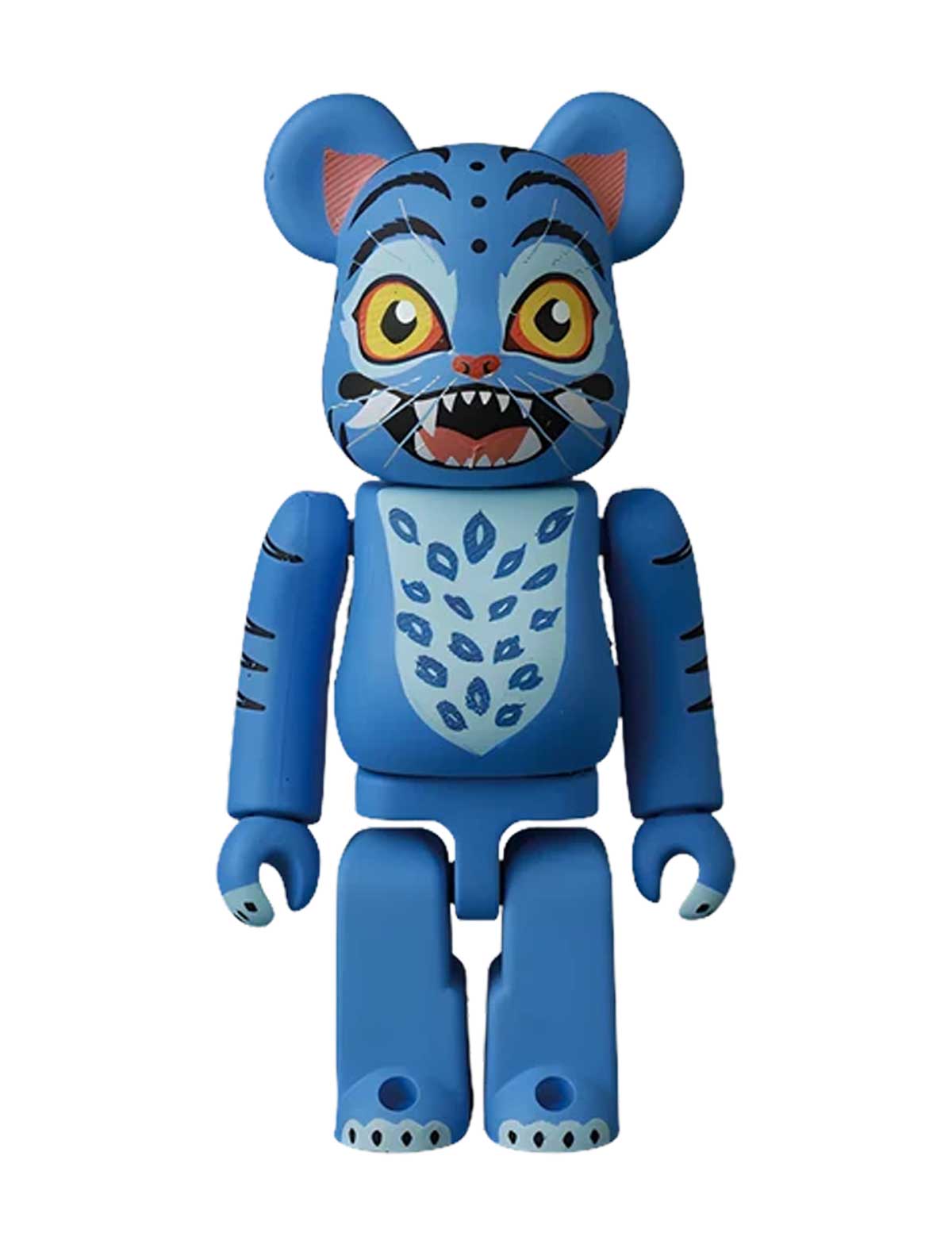 A blue bear-shaped collectible figure with tiger-like facial features, including yellow eyes, black stripes, and a toothy grin, standing against a plain white background.