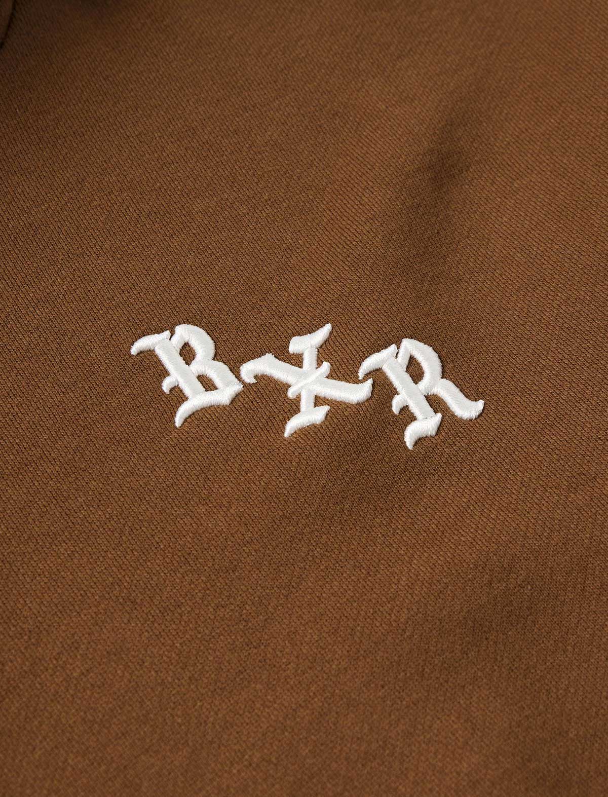 White logo on a brown background