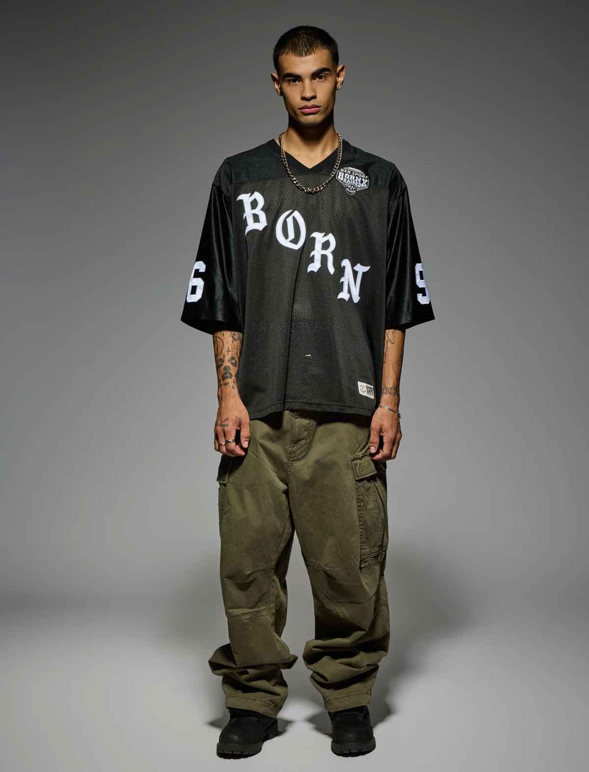 Born X Raised Paranoia Football Jersey in Black – front, worn