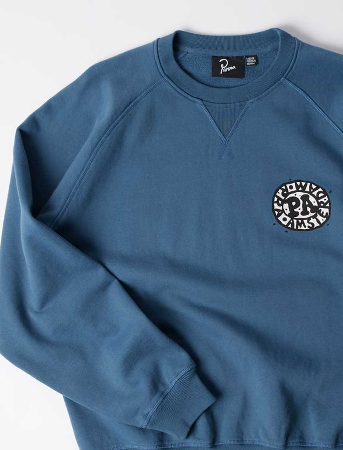 By Parra Amsterdammed Crew Neck Sweater Washed Blue Front Sleeve Detail