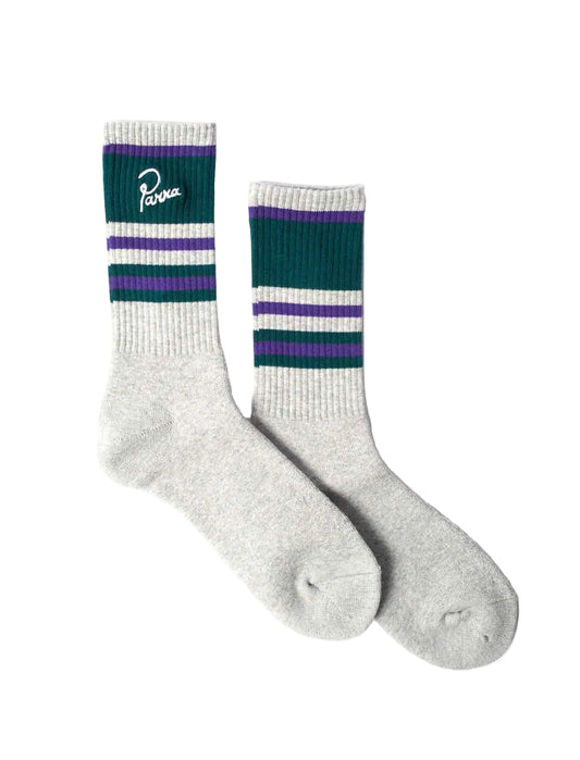 A pair of crew socks in light heather gray with dark green and purple stripes near the cuff. One sock has a white script logo reading 'Parra' on the green cuff section.