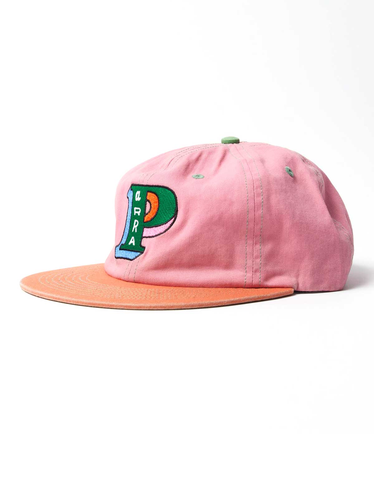 A pink cotton flat-brim cap with a peach-orange visor and a colorful embroidered 'PARRA' patch on the front, set against a plain white background.