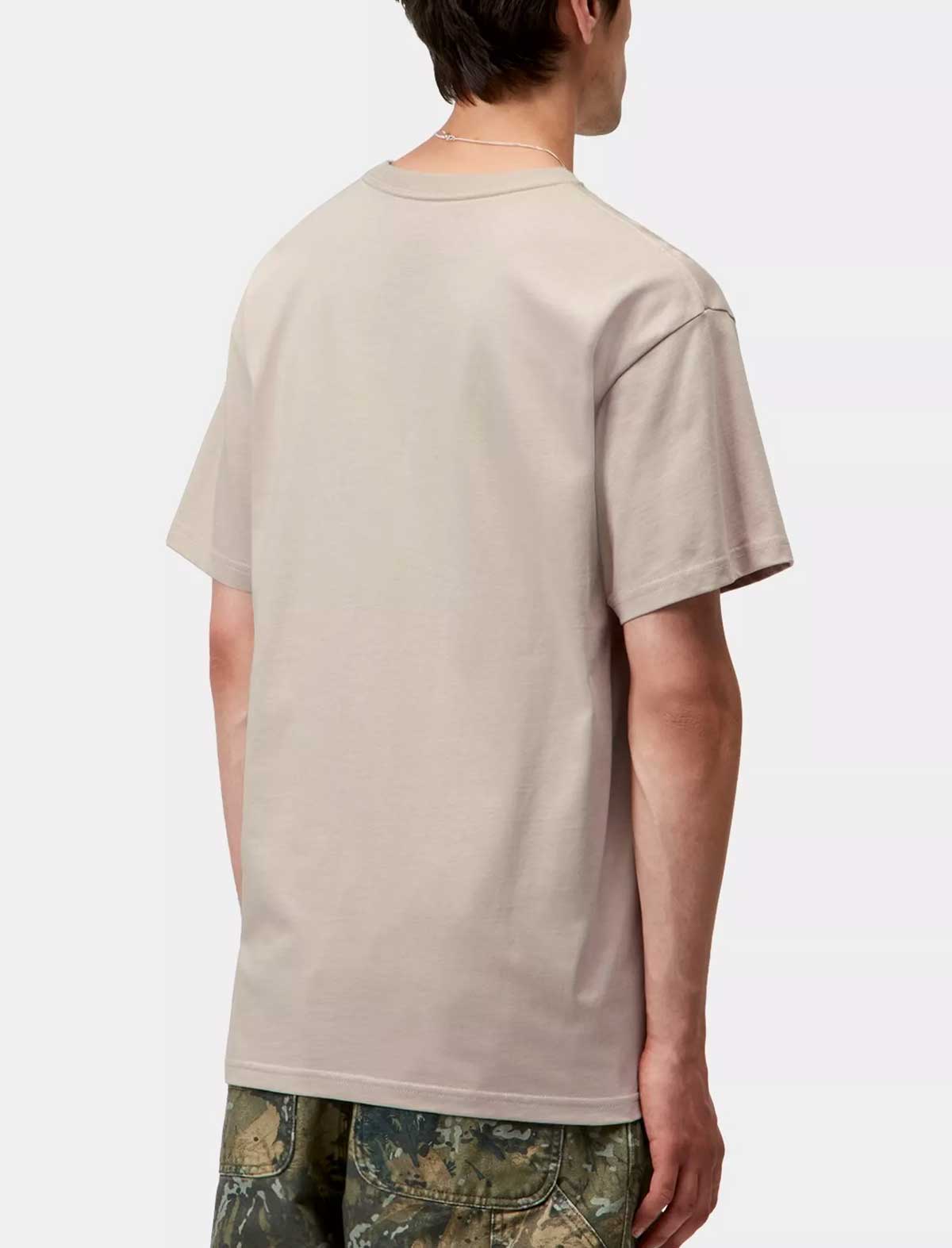 Person wearing a carhartt wip chase beige t-shirt and camouflage pants on a white background